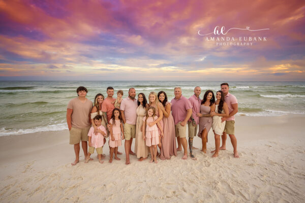 Destin family photographer captures large extended family of twenty in pink and tan at sunset