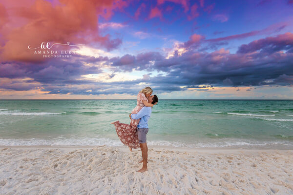 Destin engagement photographer captures playful couple kissing on the beach
